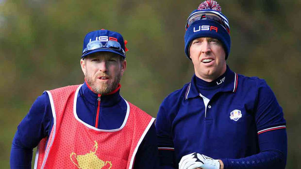 Hunter Mahan talks to caddie John Wood on the seventh tee during the Morning Fourballs of the 2014 Ryder Cup on the PGA Centenary course at the Gleneagles Hotel in Auchterarder, Scotland.